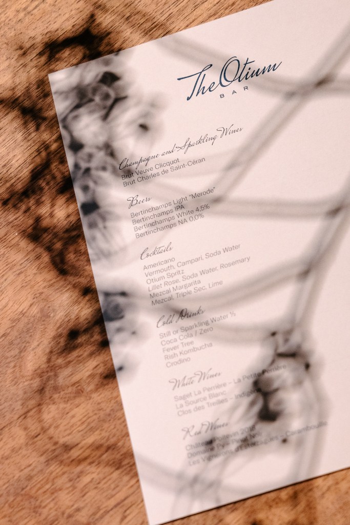 Printed restaurant menu placed on a table, refined typography for hospitality dining experience